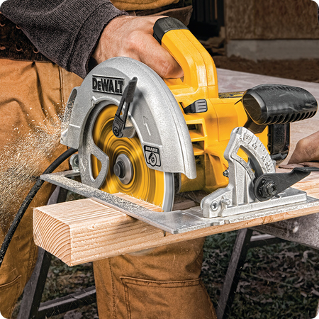 Man cutting wood with DEWALT 7-1/4 Inch 24T Carbide Thin Kerf Framing Circular Saw Blade
